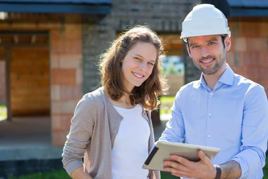 View of a Young woman and architect on construction site