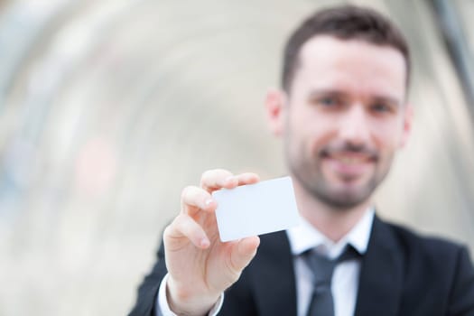 View of an Attractive businessman showing an empty textspace card