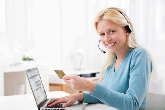 View of an Attractive blonde woman shopping online