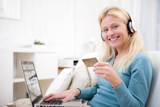 View of an Attractive blonde woman shopping online