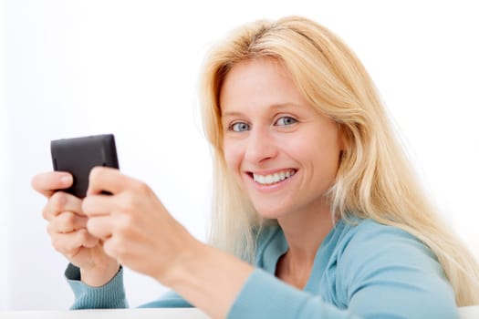 View of Young relaxed woman sending text