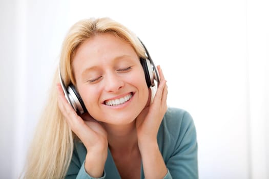 View of a young attractive woman listenning music