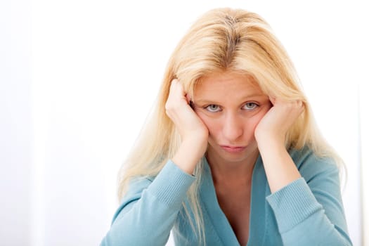 View of a Portrait of a blonde woman pulling a face