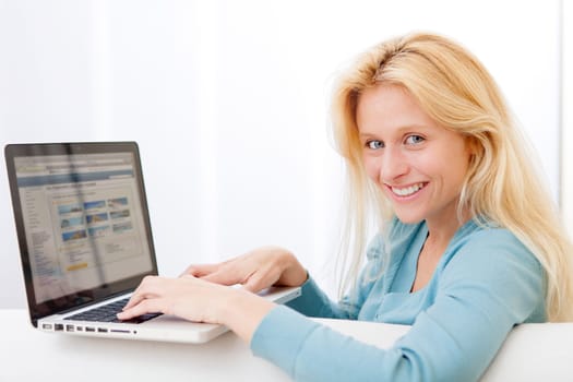 View of a Young attractive woman surfing on internet