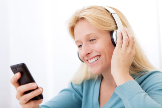 View of a young attractive woman listenning music
