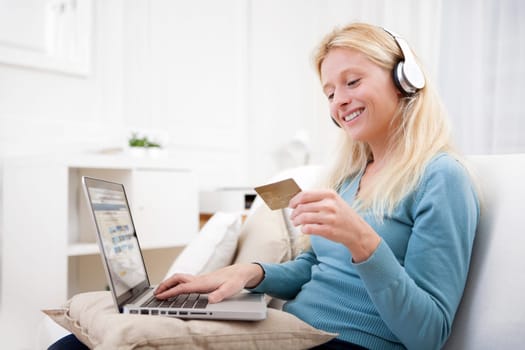 View of an Attractive blonde woman shopping online