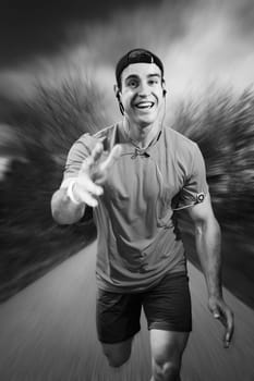 Frontal full-body view of a young man in a sports dress happily running towards the camera