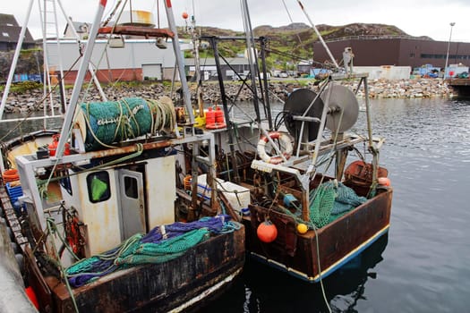 Fishing boats with colourful fishing nets in Scotland