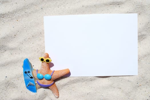 Empty postcard with starfish figure in the sand