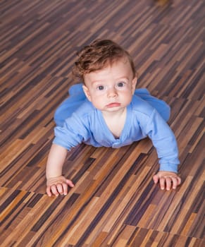 Portrait of a 7 months old baby boy at home.
