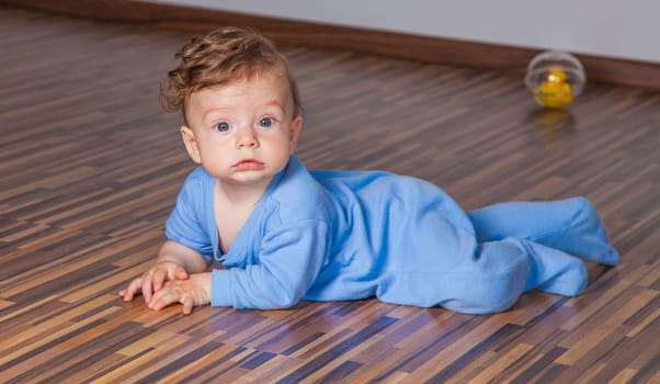 Portrait of a 7 months old baby boy at home.