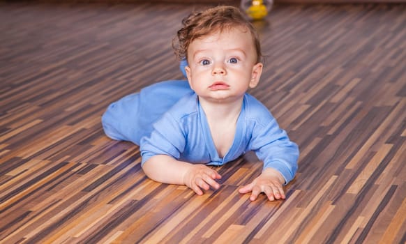 Portrait of a 7 months old baby boy at home.