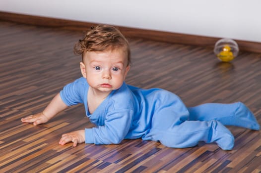 Portrait of a 7 months old baby boy at home.