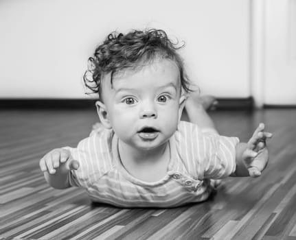 Portrait of a 7 months old baby boy at home.