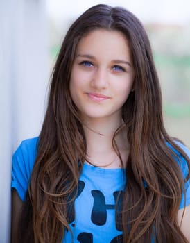 Outdoor portrait of beautiful teenage girl in spring.