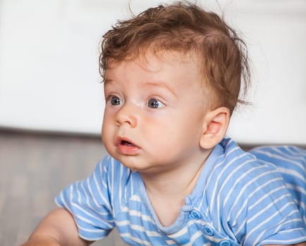 Portrait of a 7 months old baby boy at home.