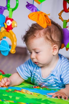 Portrait of a 7 months old baby boy at home.
