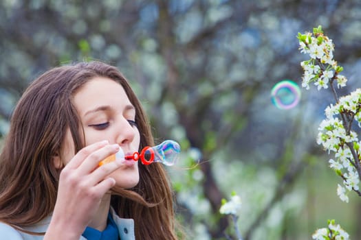 Outdoor portrait of beautiful teenage girl in spring.