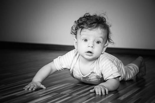 Portrait of a 7 months old baby boy at home.