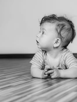 Portrait of a 7 months old baby boy at home.