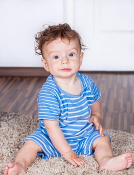 Portrait of a 7 months old baby boy at home.