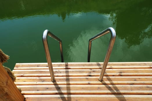 Deck on swimming pool in nature