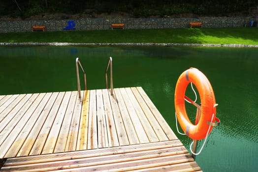 Deck on swimming pool in nature
