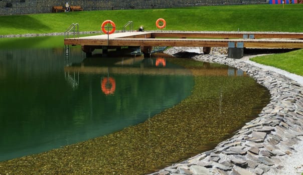 Deck on swimming pool in nature