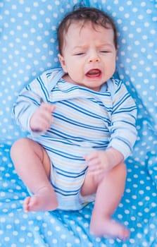 Portrait of a 2 months old baby boy at home.