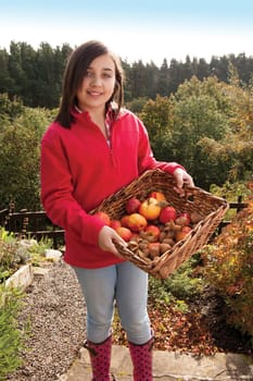 Girl with basket of hand-picked fruit