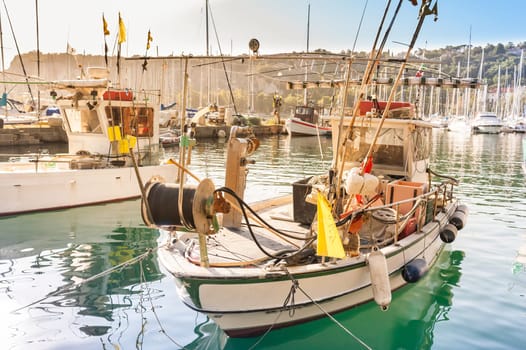 Fishing boats in the port of Sistiana, Trieste, Italy at sunset