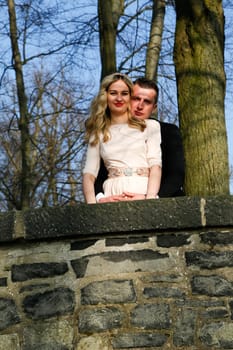 Enamoured couple enjoying their love in the garden