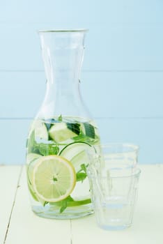 Flavoured water or infused water with cucumbers,lemons and mint in a carafe