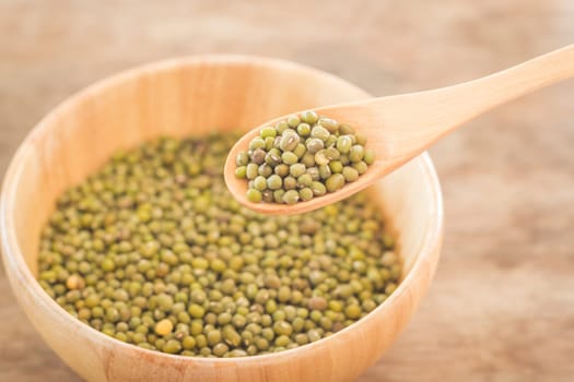 Raw green bean in wooden bowl, stock photo