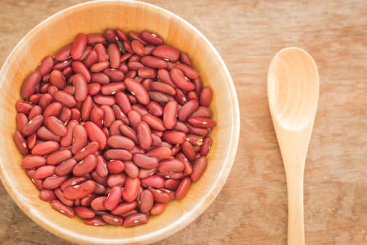 Raw red kidney bean in wooden bowl, stock photo