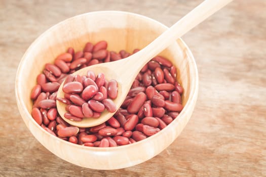 Raw red kidney bean in wooden bowl, stock photo