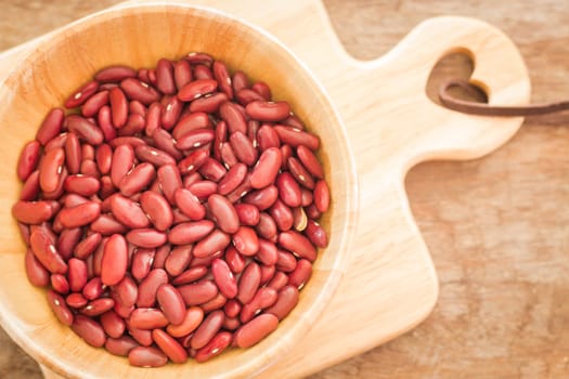 Raw red kidney bean in wooden bowl, stock photo
