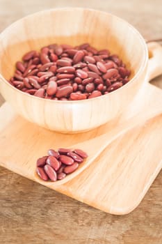 Raw red kidney bean in wooden bowl, stock photo