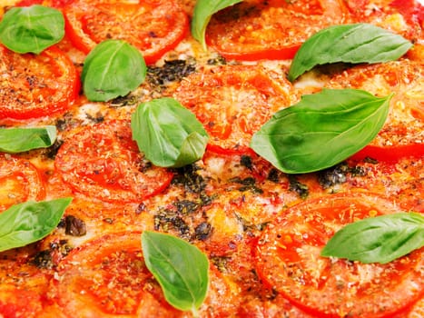 Margharita Pizza - with fresh tomatos, mozzarella and basil, close up