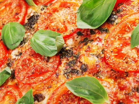 Margharita Pizza - with fresh tomatos, mozzarella and basil, close up