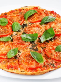 Margharita Pizza - with fresh tomatoes, mozzarella and basil, close up