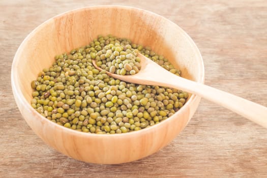 Raw green bean in wooden bowl, stock photo