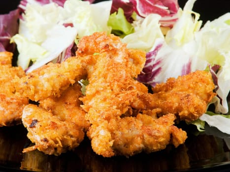 Crispy fried chicken with cornflakes and salad