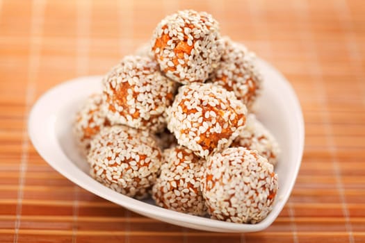 Homemade healthy candies made of dried apples and sesame