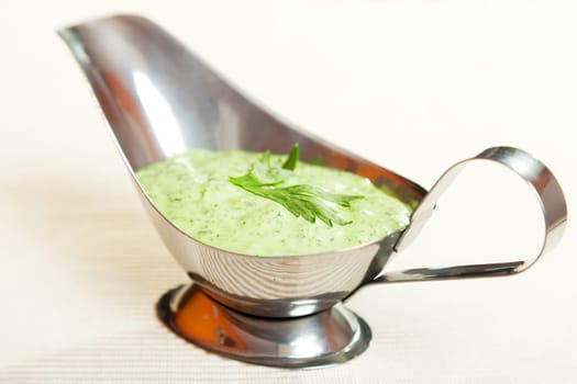 Salad dressing with mayonnaise and fresh green herbs