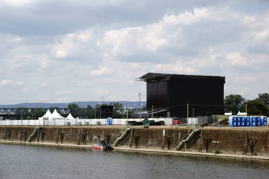 Mainz,Germany – June 24,2015: The cordoned-off stage and concert area Nordmole Zollhafen in Mainz with beer tents and Dixi toilets on June 24,2015 in Mainz.