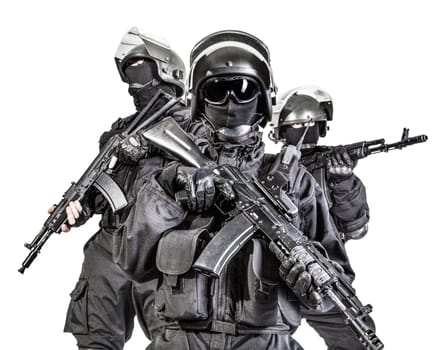 Russian special forces operators in black uniform and bulletproof helmets