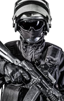 Russian special forces operator in black uniform and bulletproof helmet