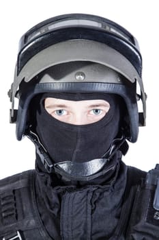 Russian special forces operator in black uniform and bulletproof helmet