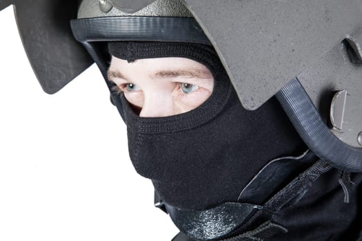Russian special forces operator in black uniform and bulletproof helmet